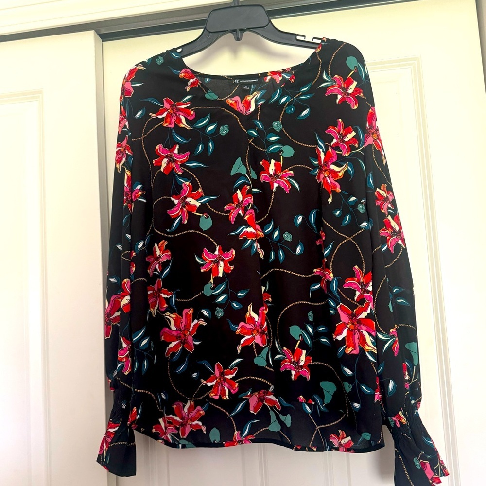 I NC floral long sleeve blouse with bell sleeve at the wrist.